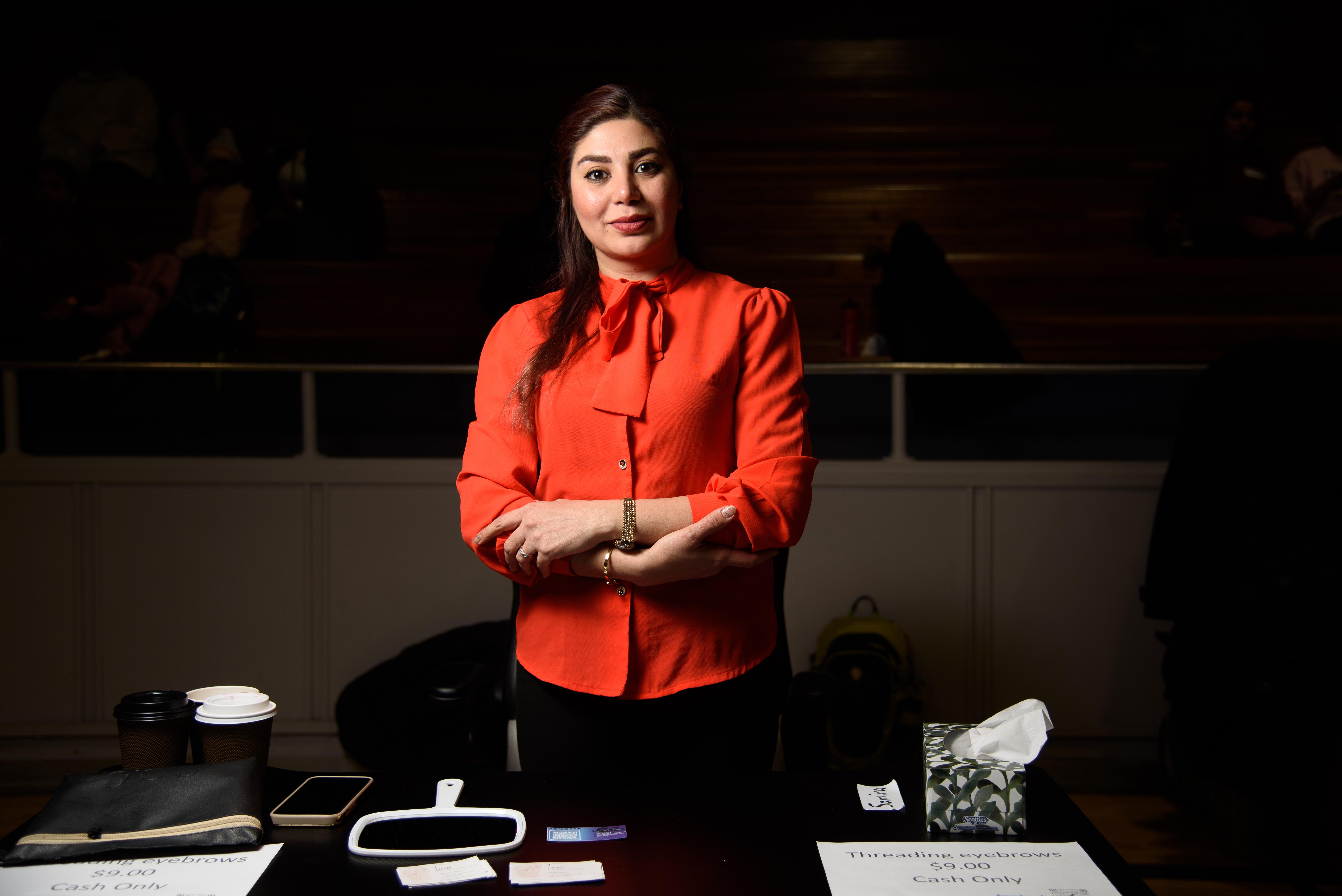 Captured an entrepreneurial female standing confidently at her vendor table at the Moncton Care Entrepreneurship event. Showcasing small business owners in action!