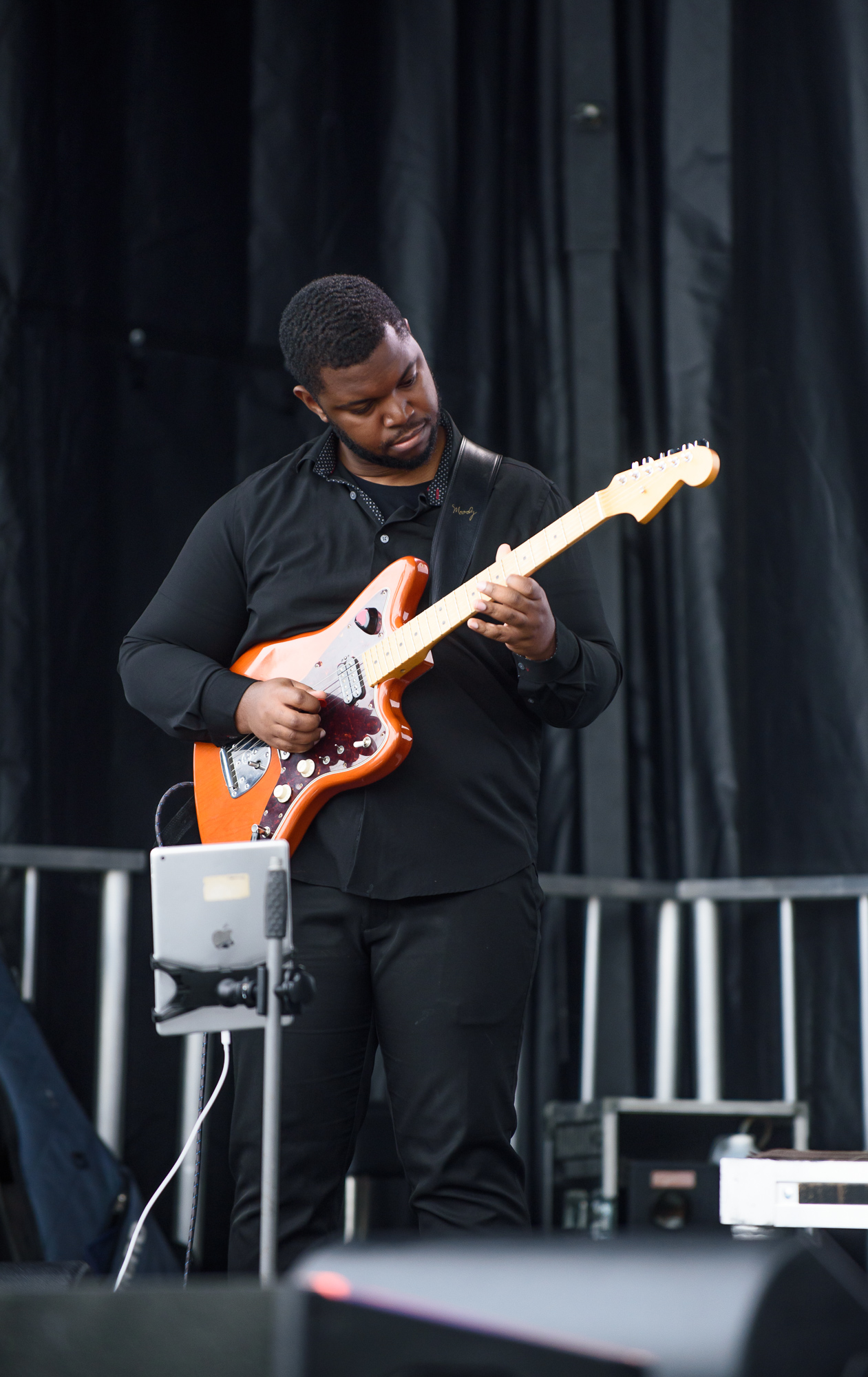 Event photography: Guitar player performing on stage at Mosaïq Multicultural Festival in Moncton, NB. Serving Saint John, Fredericton, and surrounding areas.
